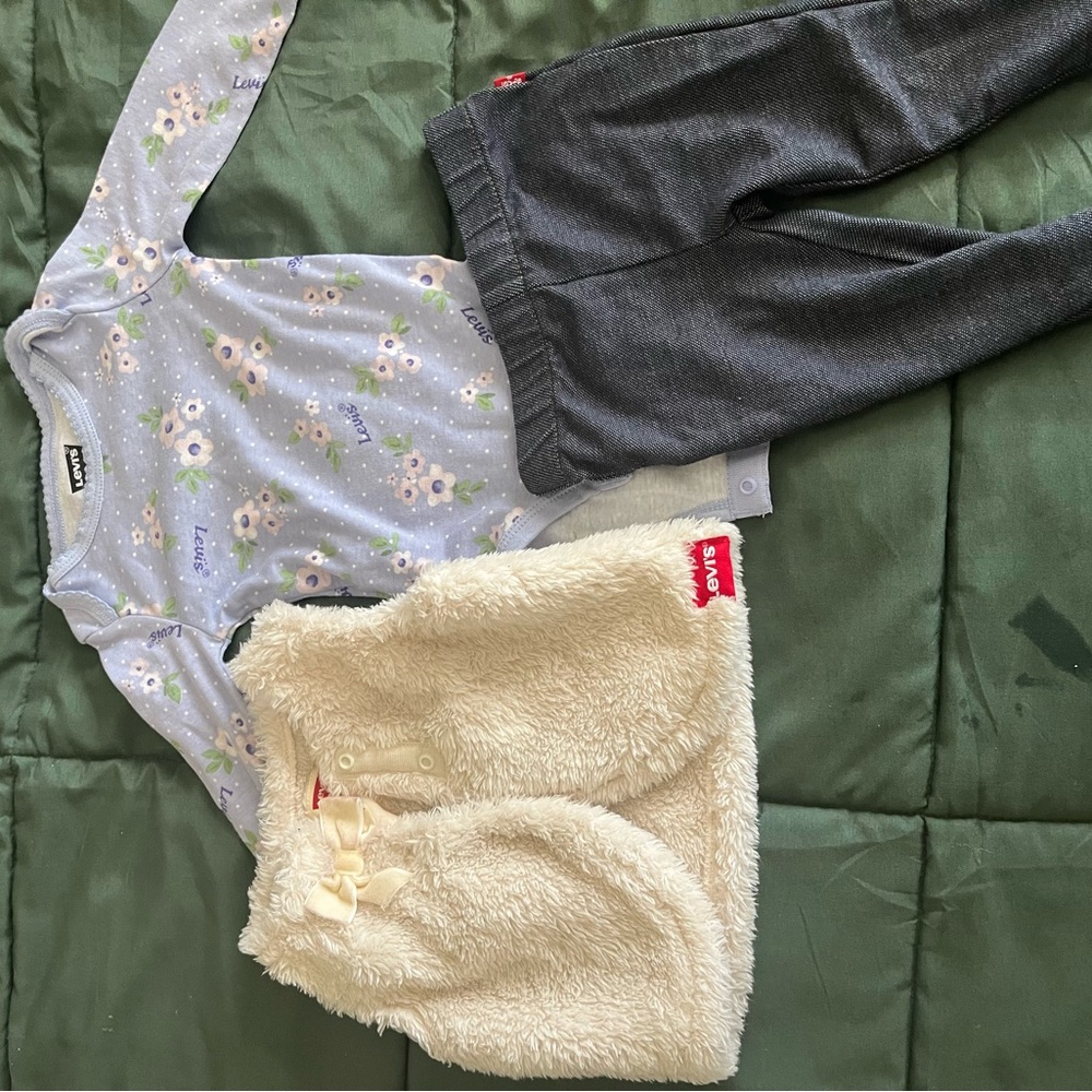 Levi's Cream Sherpa Vest with Lavender Floral Bodysuit and Charcoal Pants